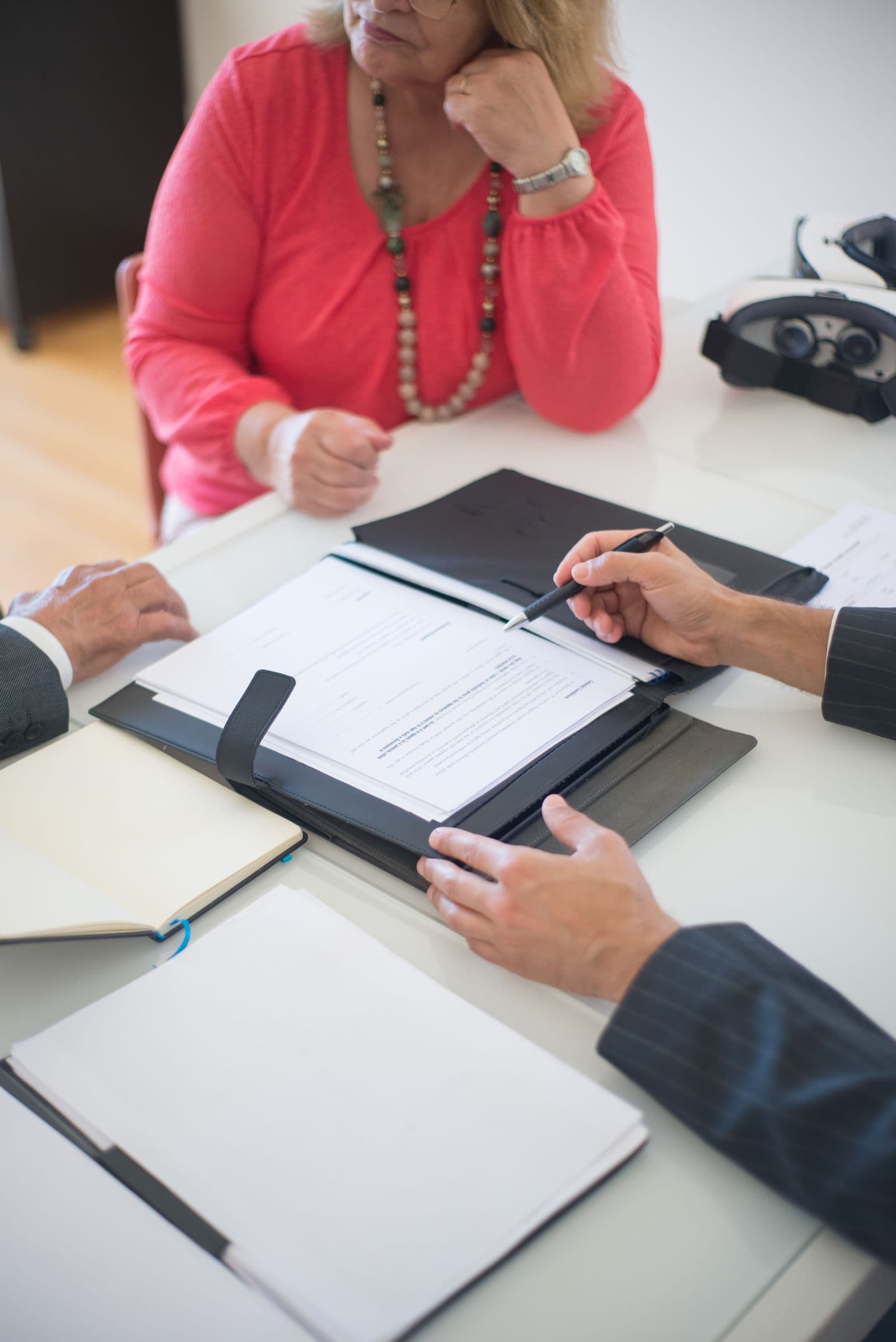 Older couple reviewing a folder of property paperwork