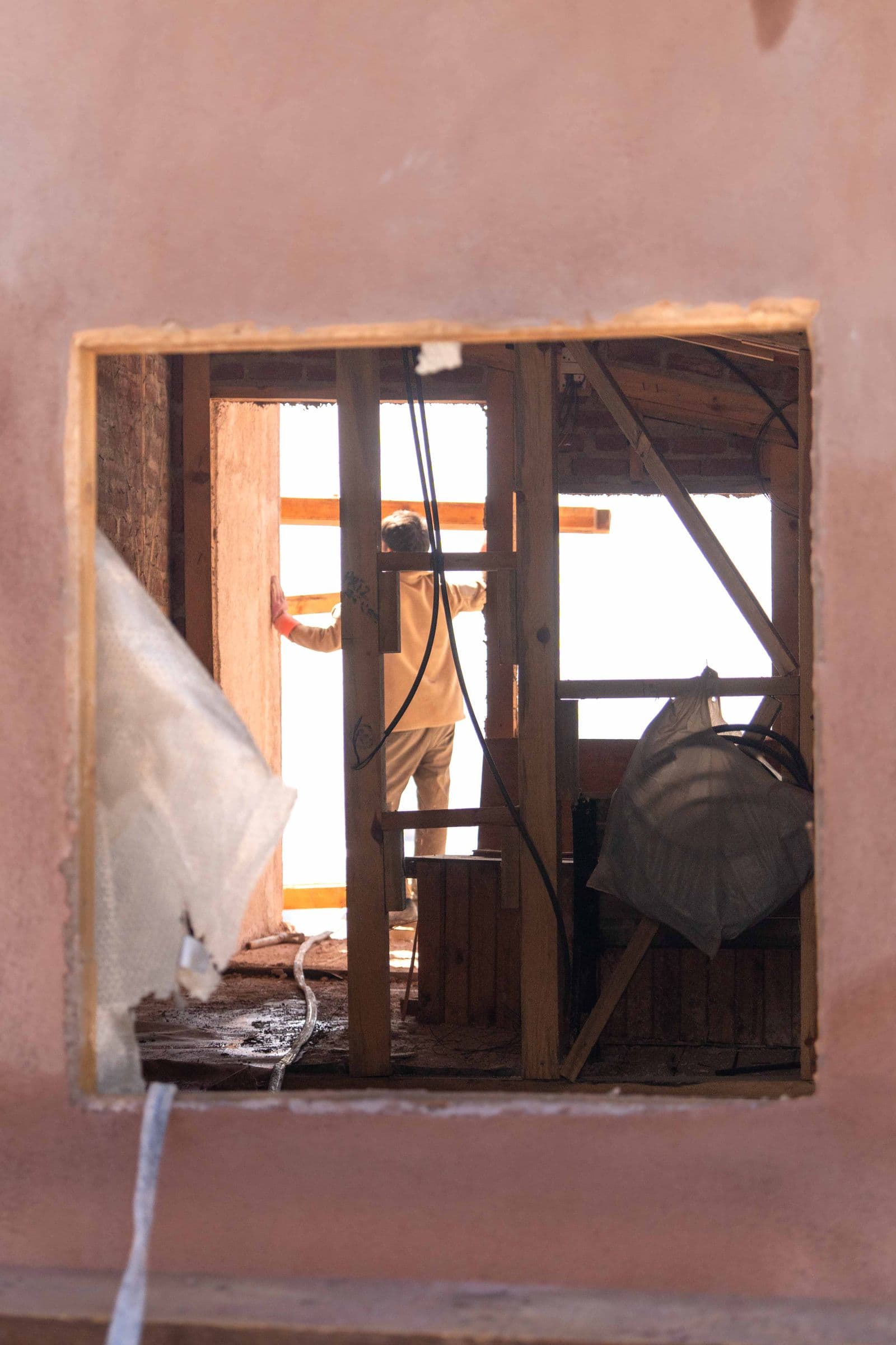 Unfinished walls and an interior opening during renovation