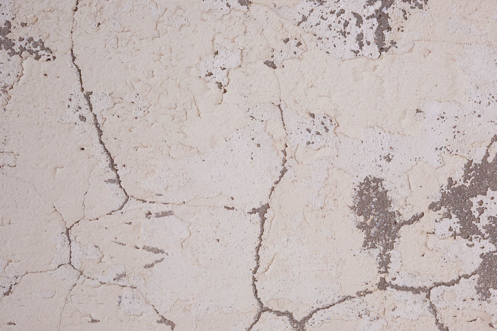 Cracks across a plaster wall