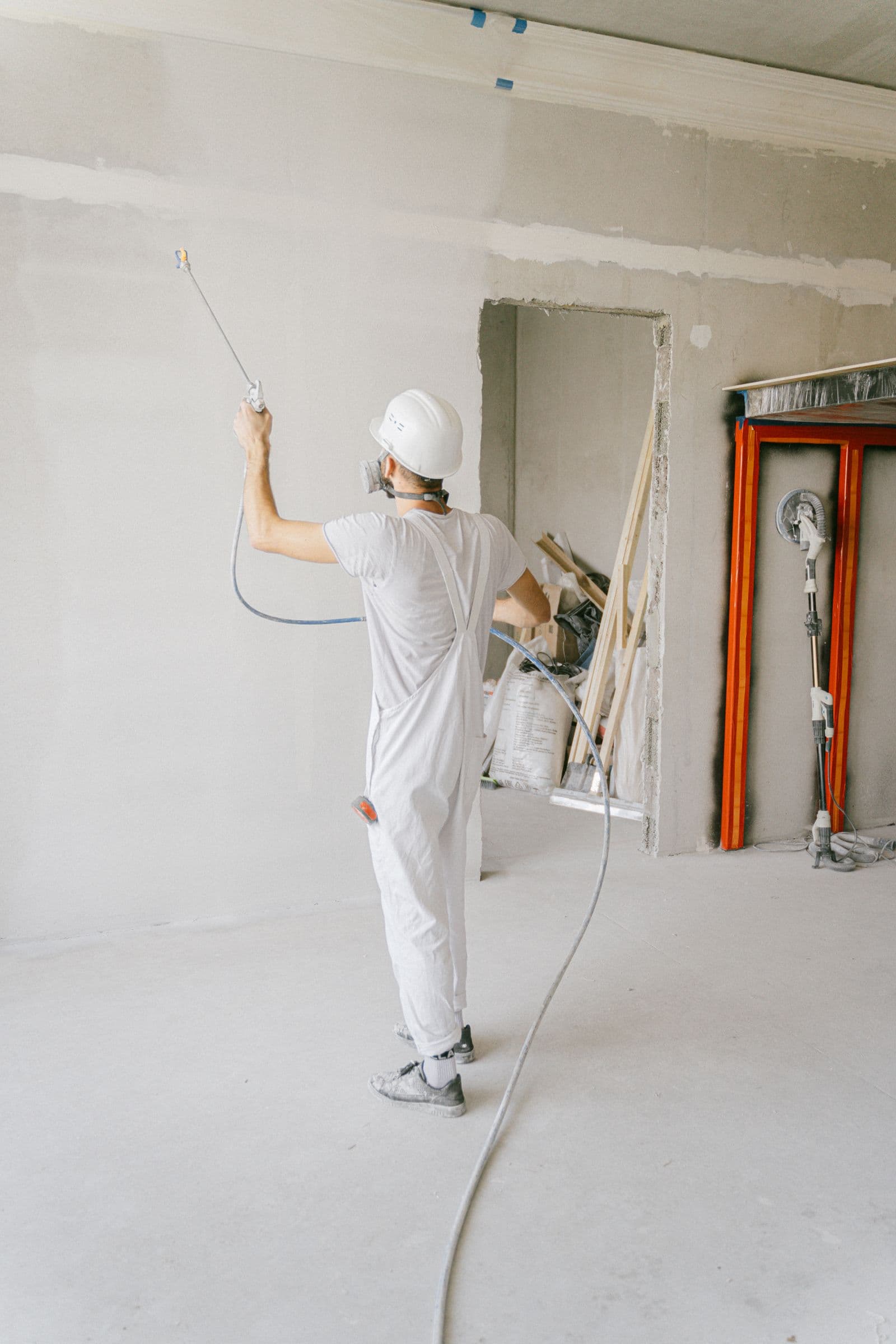 Worker repairing an unfinished room